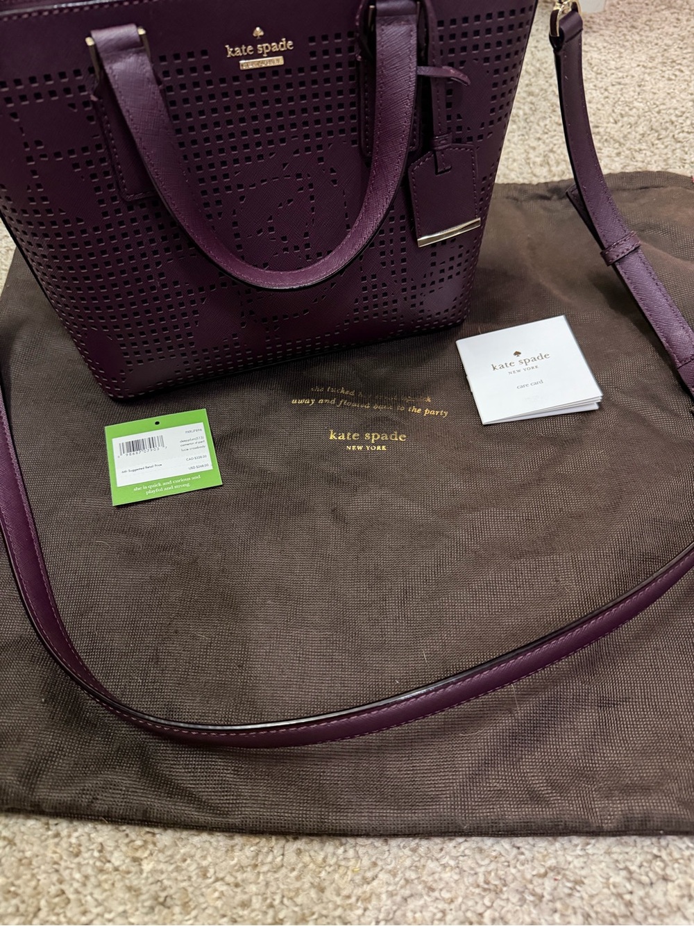 kate spade plum perforated leather tote with gold logo